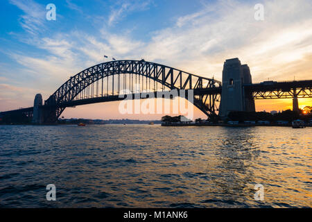 Sunset skyline of Sydney downtown with Harbour Bridge, NSW, Australia ...