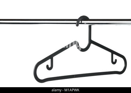 Empty black coat hanger / clothes hanger on a clothes rail with a white background. Potential copy space above and to the left of hanger. Stock Photo