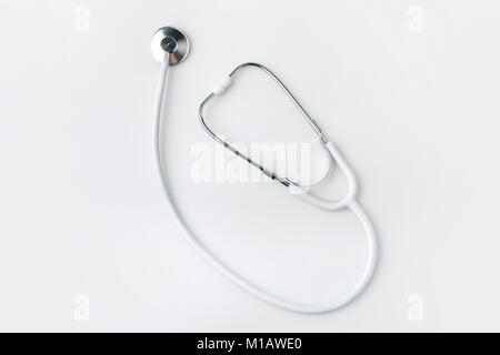 stethoscope laying isolated on white background    Stock Photo