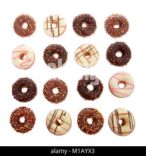 Many candy coated mini donuts top view isolated on white background. Flat lay in square pattern. Stock Photo