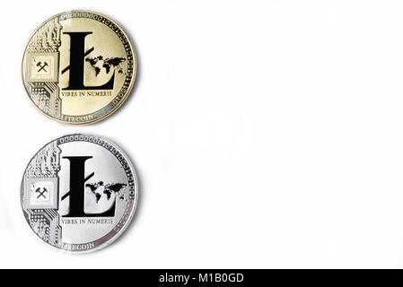 On a white background are silver coins of a digital crypto currencies - Litecoin and Bitcoin. In addition to the lying coin, there are one standing bi Stock Photo