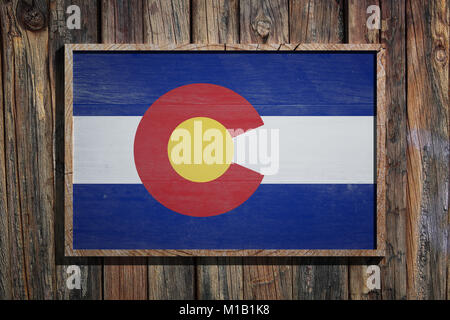 3d rendering of a Colorado State USA flag on a wooden frame and a wood wall Stock Photo