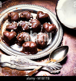 chocolate candy with coconut in the form of a heart Stock Photo