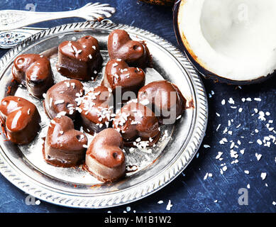 chocolate candy with coconut in the form heart Stock Photo