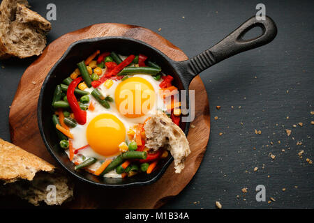 Fried eggs in a cast iron Stock Photo