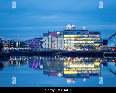 Evening view of BBC Scotland headquarters reflected in River Clyde in Glasgow , Scotland, United Kingdom Stock Photo