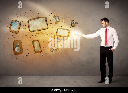 Man throwing hand drawn electronical devices concept Stock Photo