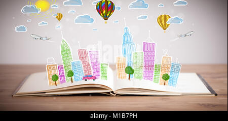 Colorful cityscape drawing on open book Stock Photo