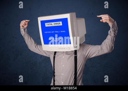 Person with a monitor head and fatal error blue screen on the display Stock Photo