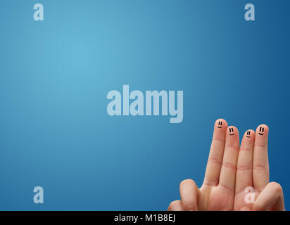 Happy smiley face fingers cheerfully looking at empty blue background copy space Stock Photo