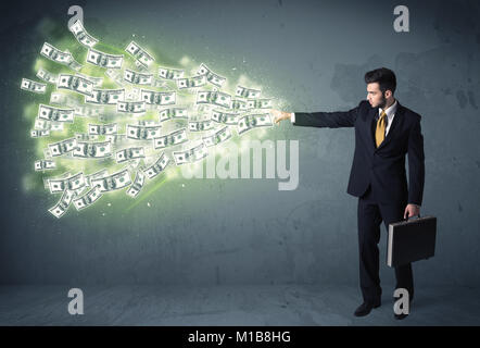 Business person throwing a lot of dollar bills concept on background Stock Photo