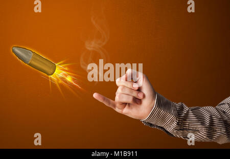 Gun shaped male hand with bullet coming out of it Stock Photo