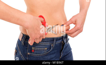 Scissors cut off excess fat at the waist. Stock Photo