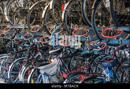 Nijmegen, Netherlands - November 7, 2017: Bicycle shed at the railway station in Nijmegen with lots of Dutch bicycles. Stock Photo