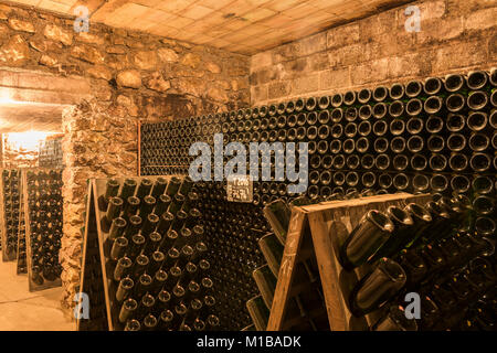 Hautvillers, France - August 11, 2017: Champagne caves and cellars with champagne bottles in pupitres in Hautvillers near Reims and Epernay. Stock Photo