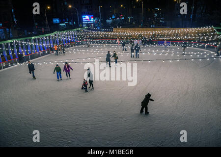 ROSTOV-ON-DON, DECEMBER 03, 2017: Skating rink with many people at winter evening Stock Photo