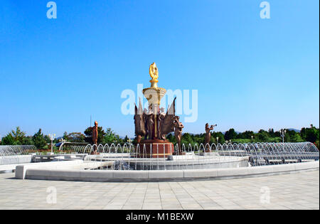 NORTH KOREA, PYONGYANG - SEPTEMBER 27, 2017: Fountain with sculptures of sentries with flags and musicians in park of Kumsusan Memorial Palace of the  Stock Photo