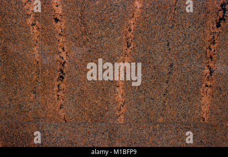 Glossy wall red stone texture background. Dark background tile material. Stock Photo