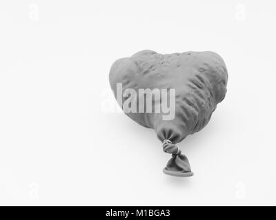 Deflate heart shape balloon in black and white isolated on white background Stock Photo