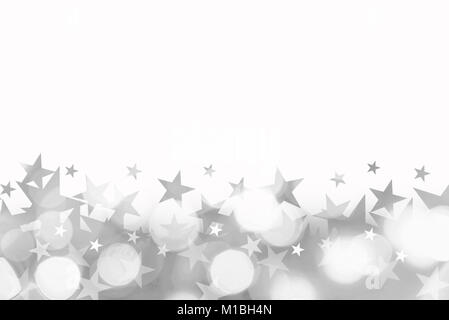 Shiny background of silver bokeh lights with stars isolated on white Stock Photo