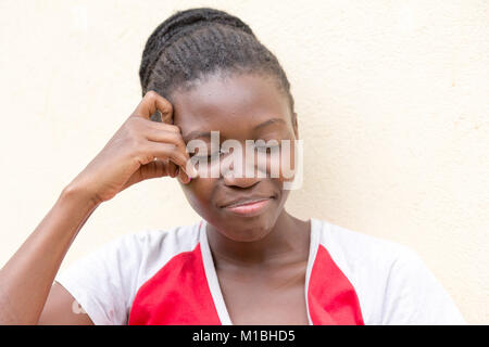 A beautiful smiling young Ugandan woman (27-year-old) Stock Photo