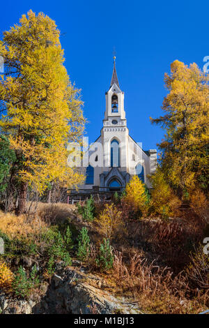 French Church and fall foliage color in the luxury resort town of St. Moritz, Switzerland, Europe. Stock Photo