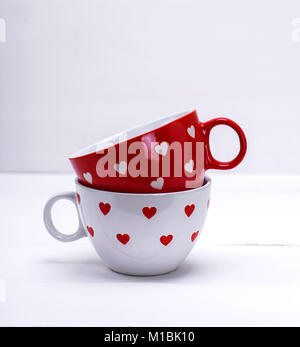 two empty ceramic mugs for coffee on a white background Stock Photo