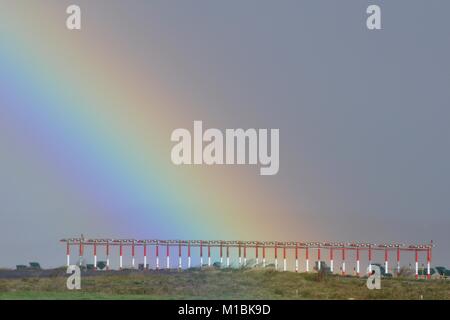 RAINBOW AT THE END OF THE RUNWAY. TENERIFE NORTH AIRPORT. Stock Photo