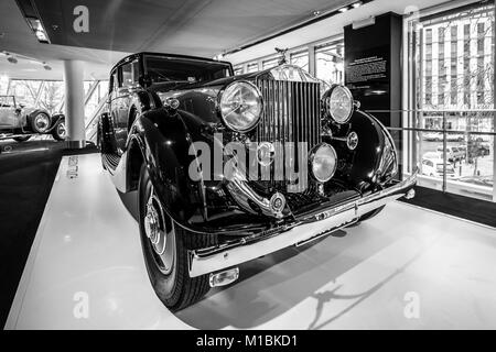 BERLIN - DECEMBER 21, 2017: Showroom. Luxury car Rolls-Royce Phantom III Touring Limousine, 1937. Coachwork by Gurney Nutting. Black and white. Stock Photo