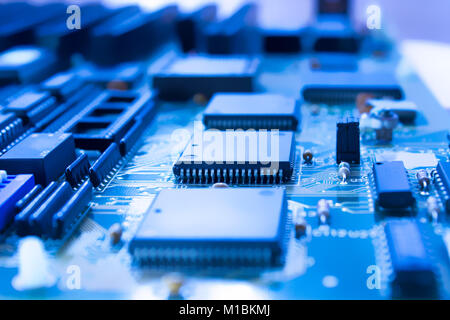 On board are capacitors resistors, slots, integrated circuits, diodes, microprocessor. Stock Photo