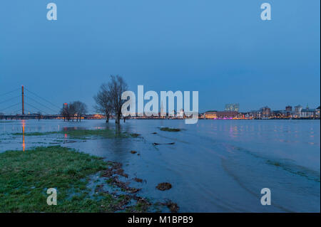 Flood on the Rhine in front of Düsseldorf's Old Town during blue hour, Düsseldorf, North Rhine-Westphalia, Germany Stock Photo