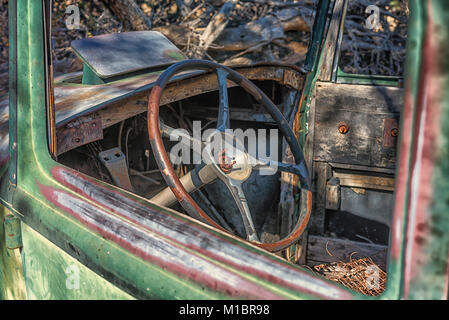 An old, abandoned car in the desert.  Joshua Tree National Park, California, USA. Stock Photo