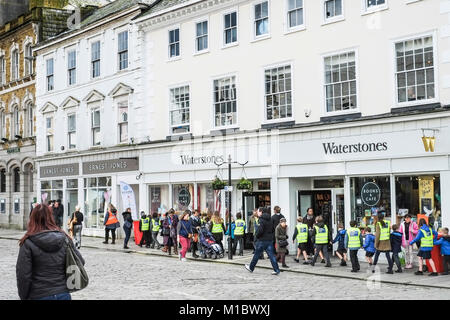 A large group of schoolchildren walking in Boscawen Street in Truro City Centre Cornwall. Stock Photo