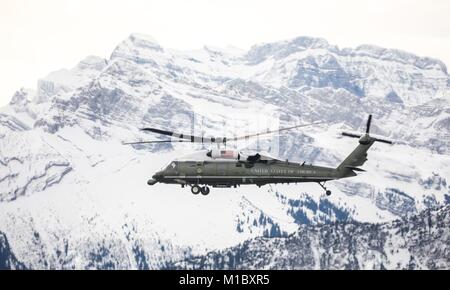 Marine One flies past the snowcapped Alps as U.S President Donald Trump arrives to attend the World Economic Forum January 25, 2018 in Davos, Switzerland. Stock Photo