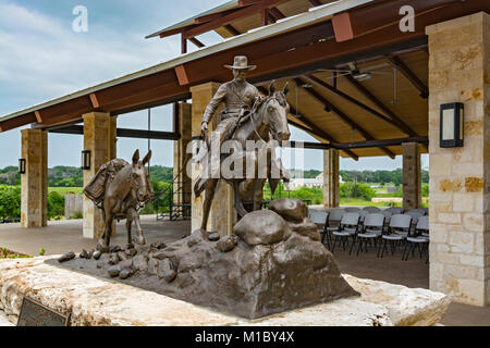 Texas, Hill Country, Fredericksburg, Texas Rangers Heritage Center, bronze sculpture of Ranger leading a pack mule by artist Richard O. Cook Stock Photo