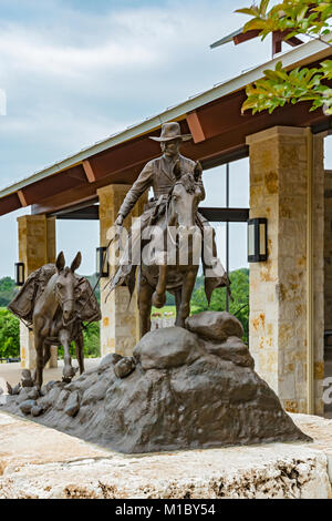 Texas, Hill Country, Fredericksburg, Texas Rangers Heritage Center, bronze sculpture of Ranger leading a pack mule by artist Richard O. Cook Stock Photo