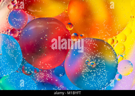 Abstract colorful Background Oil in Water surface Foam of Soap with Bubbles chemical effect macro shot close-up liquids do not mix Stock Photo