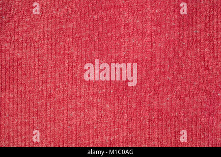 fabric in red color, closeup on stitch Stock Photo