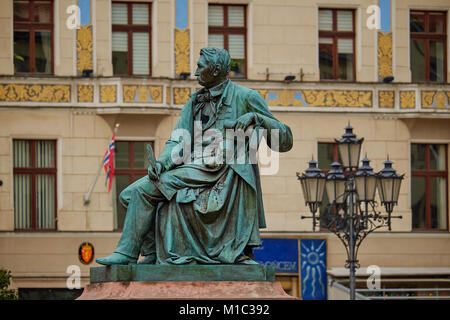 Neoclassical bronze statue of famous Polish writer Alexander Fredro, 1897, by Leonard Marconi, Wroclaw's main market square, Lower Silesia Poland Stock Photo