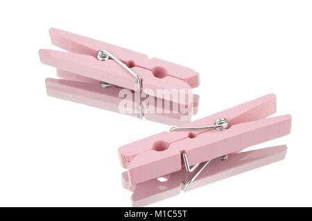 Two pink clothespins against a white background Stock Photo