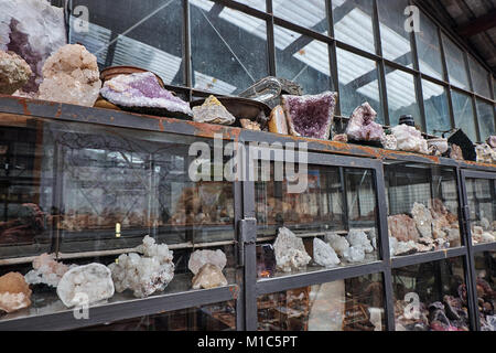 Crystal quartz mineral stones on the shelves in the local mountain shop Stock Photo