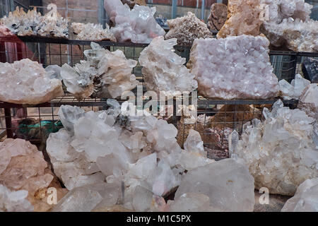 Crystal quartz mineral stones on the shelves in the local mountain shop Stock Photo