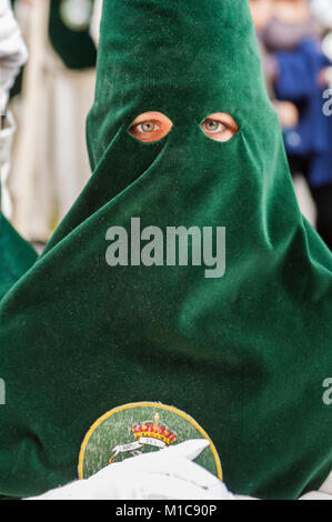 Portrait of a penitent of the brotherhood of 'El Beso de Judas' during the penitential journey. Stock Photo