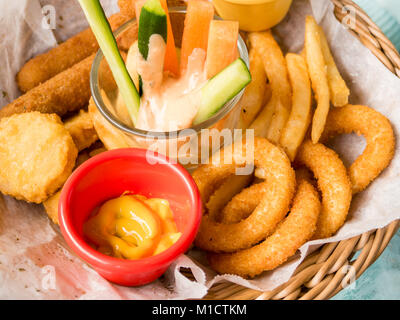 Platter of fried food, cheese sticks, onion rings, chicken nuggets Stock Photo