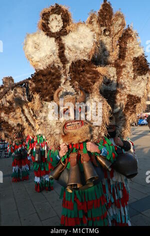 People with mask called Kukeri dance and perform to scare the evil spirits at the International Festival of Masquerade Games Surva Stock Photo