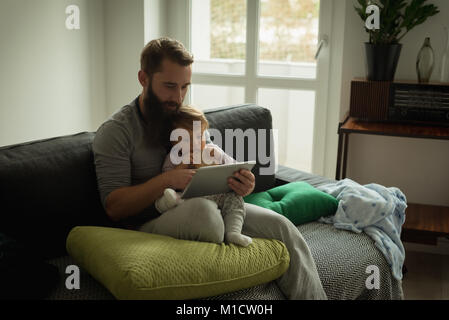 Father and son using digital tablet Stock Photo