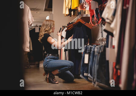 Beautiful woman shopping for clothes Stock Photo