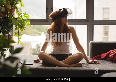 Woman using virtual reality headset Stock Photo
