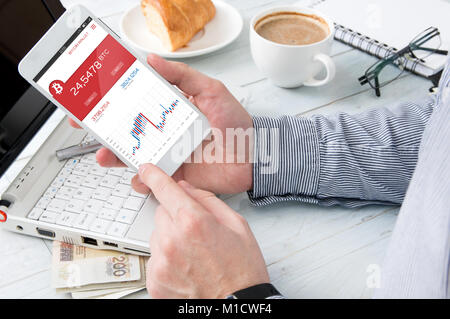 Man checks bitcoin rate at forex market application. Smartphone interface created in graphic program Stock Photo