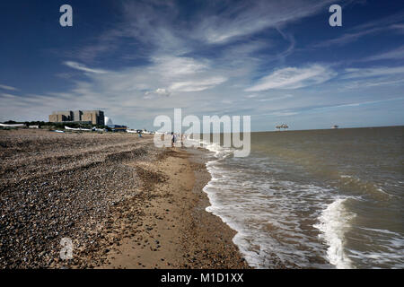 walking past sizewell power station on the beach at sizewell suffolk england uk Stock Photo